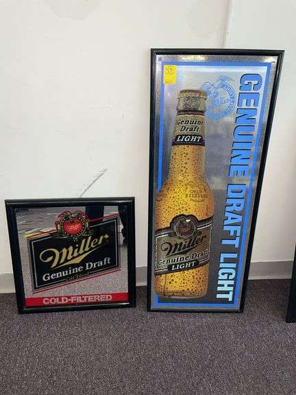 Two Miller genuine draft beer signs. The large one is approximately 37 x 18”.