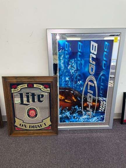 Bud Light and Miller light framed hanging signs. The Bud Light sign is approximately 48 x 32”.