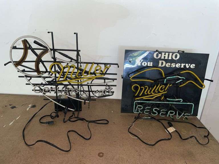 (2) neon Miller signs. When plugged in both buzz and show small flickers of light but do not light up. These signs are approximately 28 inches wide and 24 inches tall.