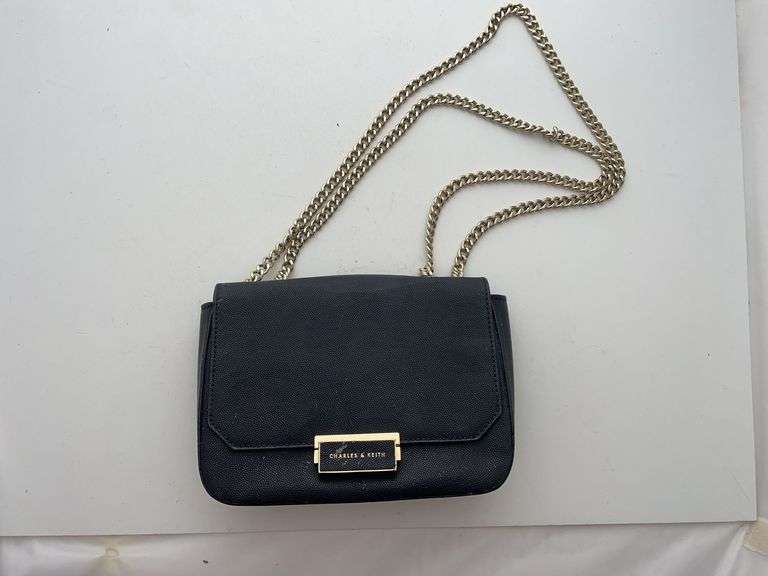 Charles and Keith handbag. With original tag somewhere in tear. Nice designer purse.