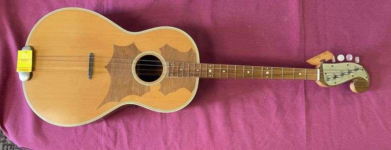 Tamburitza, specifically a Brac or Bass-Prim style tenor guitar