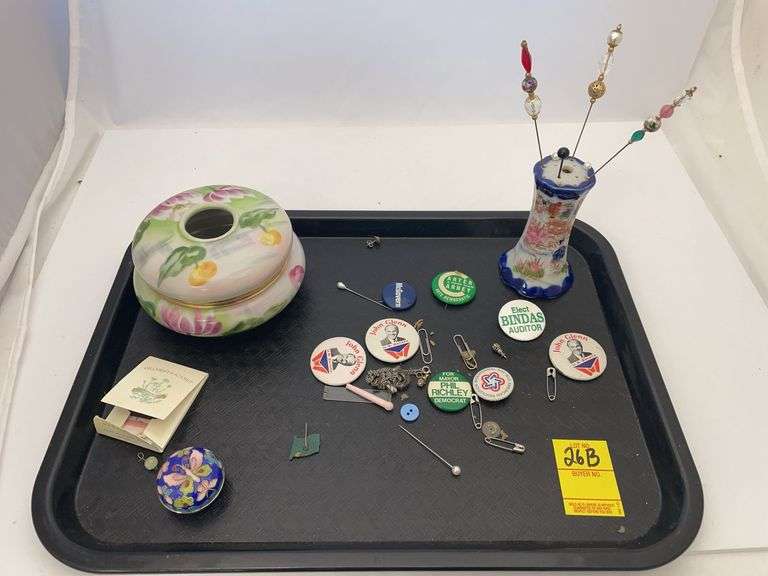 Vintage political pins. Ornate jewelry, containers, and vintage women’s decorative hair pins in holder.