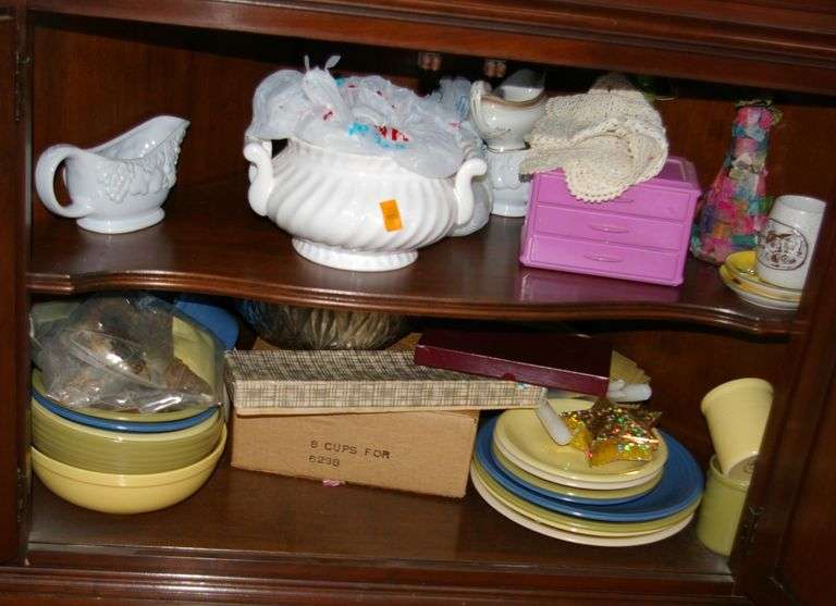 Lower section of cabinet: soup tureen, porcelain, vintage mixing bowls