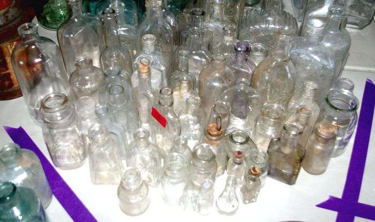 Large Collection of Clear Glass Medicine Bottles