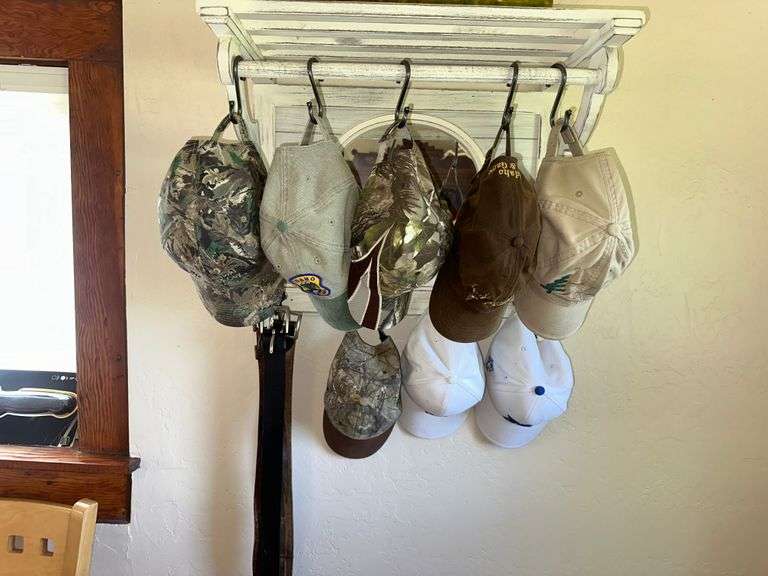 White Shelf Coat and Hat Rack with Collection of Baseball Hats, Leather Belts