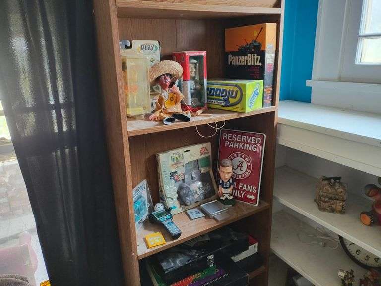 Shelf with Contents, Metal Sign, Pencil Sharpener, Handheld Game, Baseball Player Figurines, Assorted Board Games, More