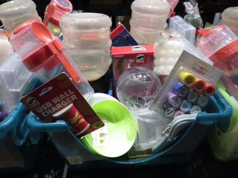 Basket with Wireless Headphones, Stamps, USB Wall Charger, and More