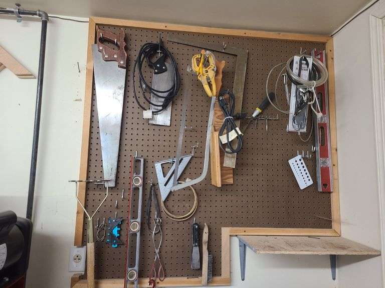 Contents of Board: Saws, Leveler, Tongs, Paint Scrapers, Electrical Cords and More