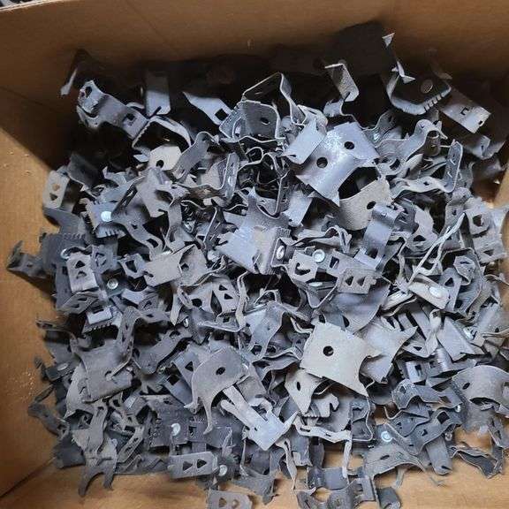 Contents of Under the Table: Fasteners, Metal Stud Clips, Roof Clips and Spacers and More