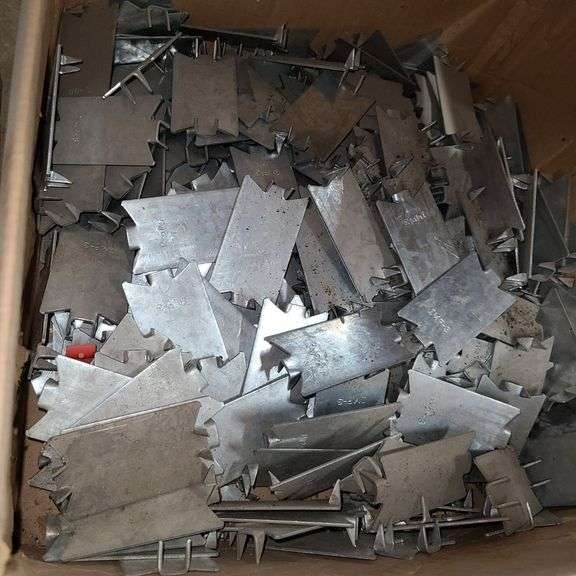 Contents of Under the Table: Fasteners, Metal Stud Clips, Roof Clips and Spacers and More