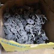 Contents of Under the Table: Fasteners, Metal Stud Clips, Roof Clips and Spacers and More