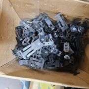 Contents of Under the Table: Fasteners, Metal Stud Clips, Roof Clips and Spacers and More