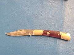4) Pocket Knives, 1) Small Mag Light
