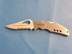4) Pocket Knives, 1) Small Mag Light