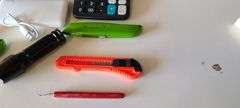Assorted Box Cutters, Amazon Basic Speakers, Charging Block, Flashlight