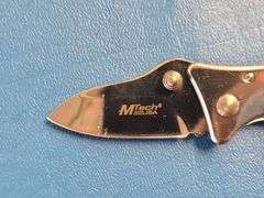 4) Pocket Knives, 1) Small Mag Light