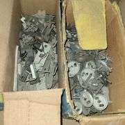Contents of Under the Table: Fasteners, Metal Stud Clips, Roof Clips and Spacers and More