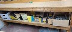 Contents of Under the Table: Fasteners, Metal Stud Clips, Roof Clips and Spacers and More