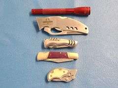 4) Pocket Knives, 1) Small Mag Light