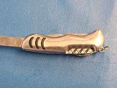 4) Pocket Knives, 1) Small Mag Light