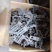 Contents of Under the Table: Fasteners, Metal Stud Clips, Roof Clips and Spacers and More