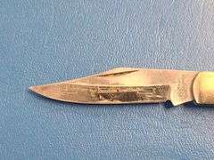 4) Pocket Knives, 1) Small Mag Light