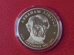 2) Abraham Lincoln Image Changing Coins, 2) Abraham Lincoln Presidential Dollar Trial Coins