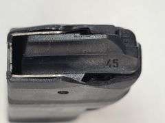 1) 9mm Magazine, 1) .45 Magazine