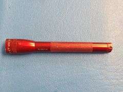 4) Pocket Knives, 1) Small Mag Light