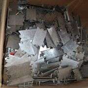 Contents of Under the Table: Fasteners, Metal Stud Clips, Roof Clips and Spacers and More