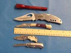 4) Pocket Knives, 1) Small Mag Light
