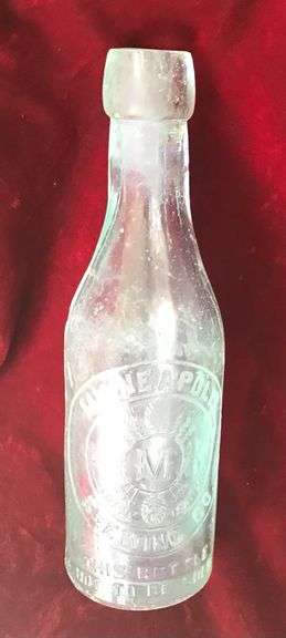 EARLY EMBOSSED BEER BOTTLE FROM “MINNEAPOLIS BREWING CO”