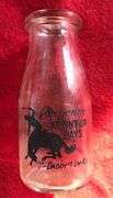 OLD PLAINS DAIRY CHEYENNE, WYO. 1/2 PINT CREAM BOTTLE-“COWBOY GRAPHICS”