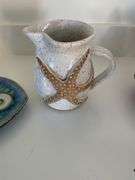 Decorative ceramic pitcher and plate