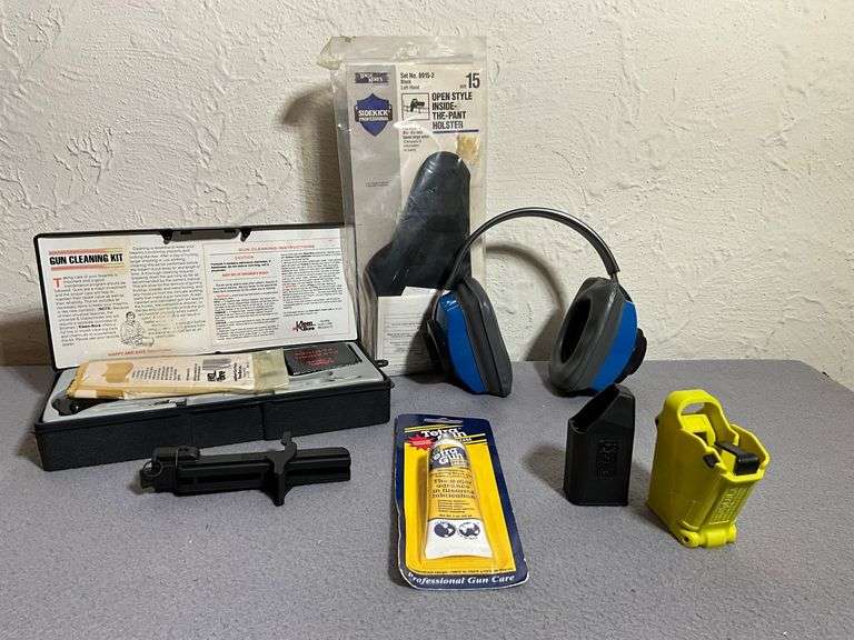 Firearm Accessories Lot with Cleaning Kit, Holster, and Ear Protection