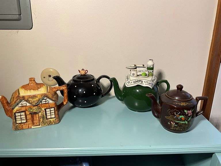 Four Decorative Teapots Including Ye Olde Cottage and Others