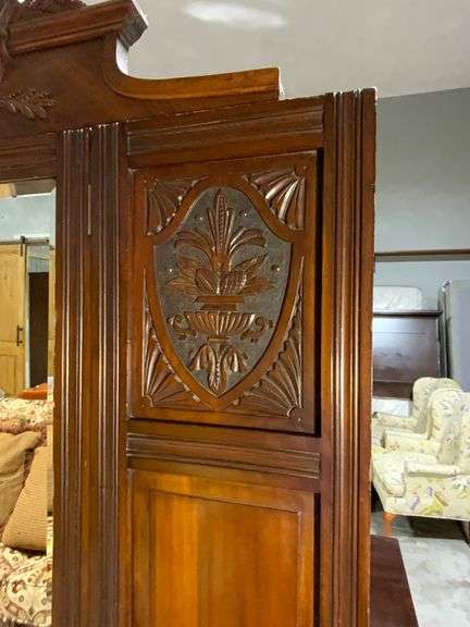 Wooden Armoire with Beveled Mirror and Carved Details
