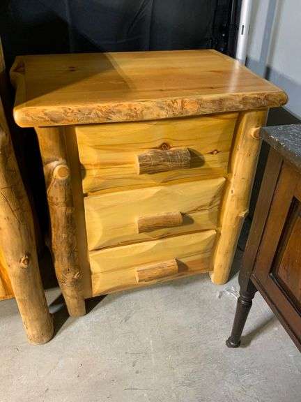 Rustic Pinewood Three-Drawer Nightstand With Natural Log Accents