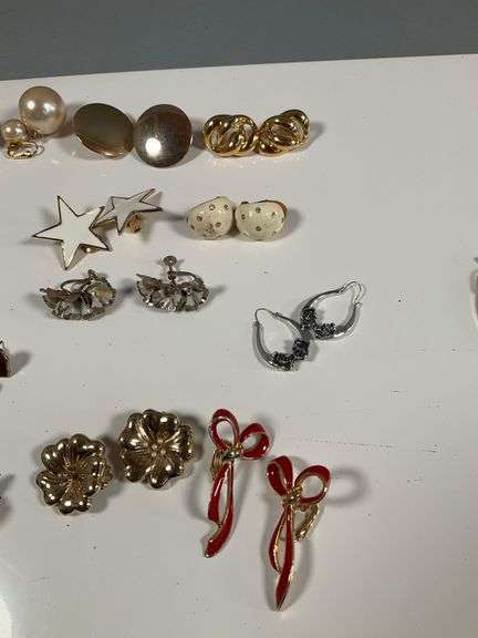 Assorted Costume Jewelry Lot Featuring Earrings, Charms, and Pendants