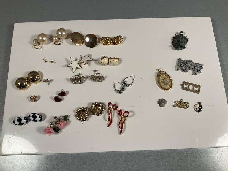 Assorted Costume Jewelry Lot Featuring Earrings, Charms, and Pendants