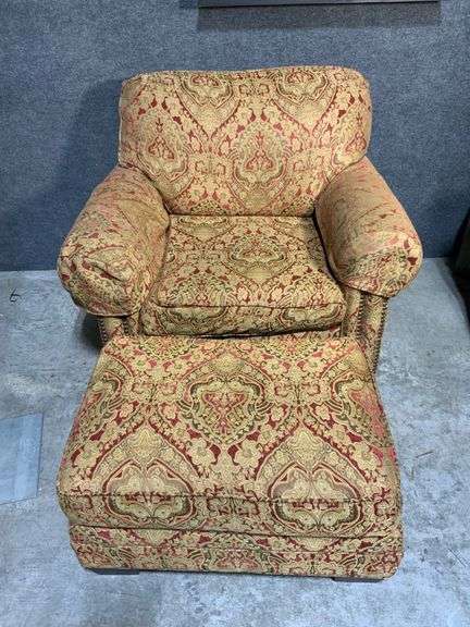 Upholstered Armchair and Ottoman with Brass Nailhead Trim