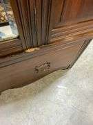 Wooden Armoire with Beveled Mirror and Carved Details