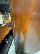 Wooden Armoire with Beveled Mirror and Carved Details