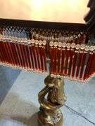 Tall Gold-Finish Cherub Floor Lamp With Glass Shade and Beaded Fringe