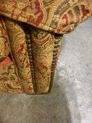 Upholstered Armchair and Ottoman with Brass Nailhead Trim