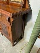 Two-Piece Wooden Sideboard With Mirrored Hutch and Carved Panel Doors