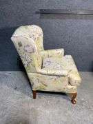 Floral Upholstered Wingback Chair With Curved Wood Cabriole Legs