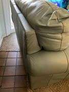 Ashley Furniture Sage Green Leather Armchair and Ottoman with Wooden Legs