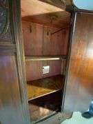Wooden Armoire with Beveled Mirror and Carved Details