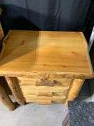 Rustic Pinewood Three-Drawer Nightstand With Natural Log Accents